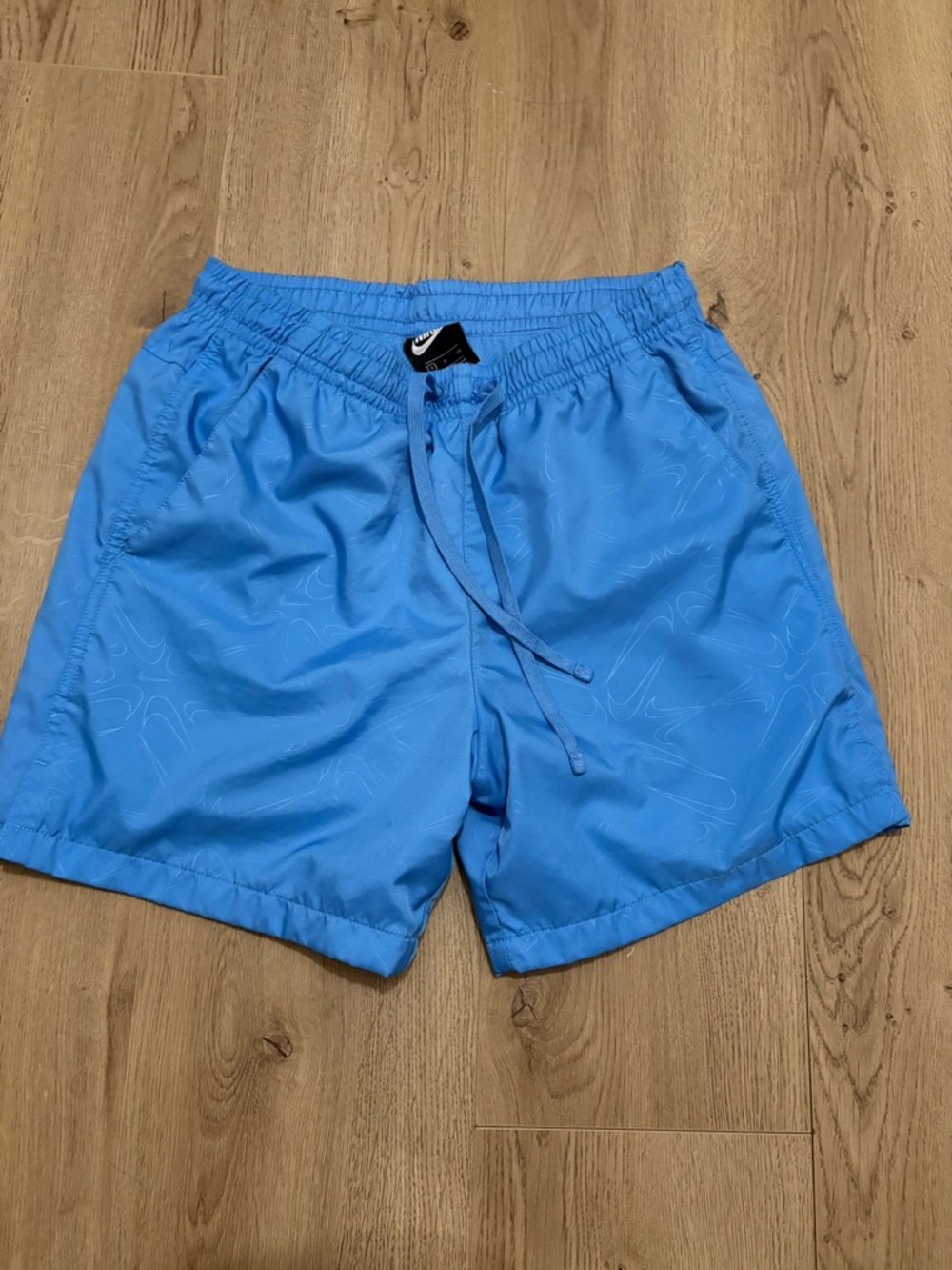 Nike Men’s Light Blue Swim Trunks with Subtle Tonal Pattern